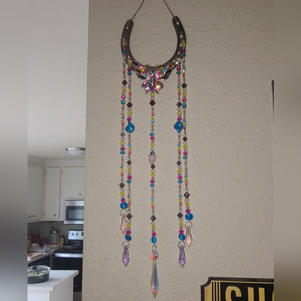 Horseshoe crystal beaded suncatcher with crysral butterfly. One of a kind.